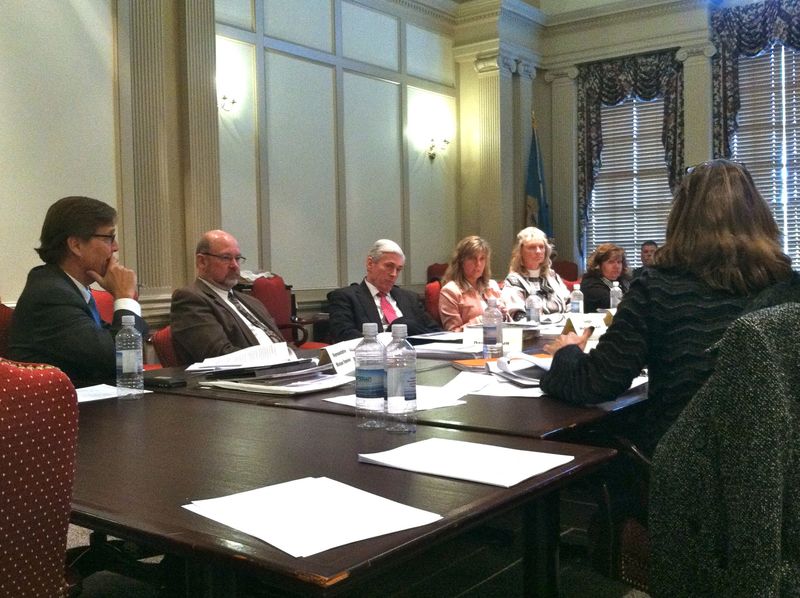 Delaware's Family Court Task Force debates opening Family Court proceedings to the public. Shown are (l-r) Rep. Mike Ramone, R-Middle Run Valley; Sen. Dave Lawson, R-Marydel; Family Court Judge Michael Newell; Tania Culley of the Child Advocate's Office; Family Law Commissioner Raetta McCall; Patricia Dailey Lewis of the Attorney General's Office; and Family Court Chief Judge Chandlee Kuhn, facing opposite. BY KARA NUZBACK